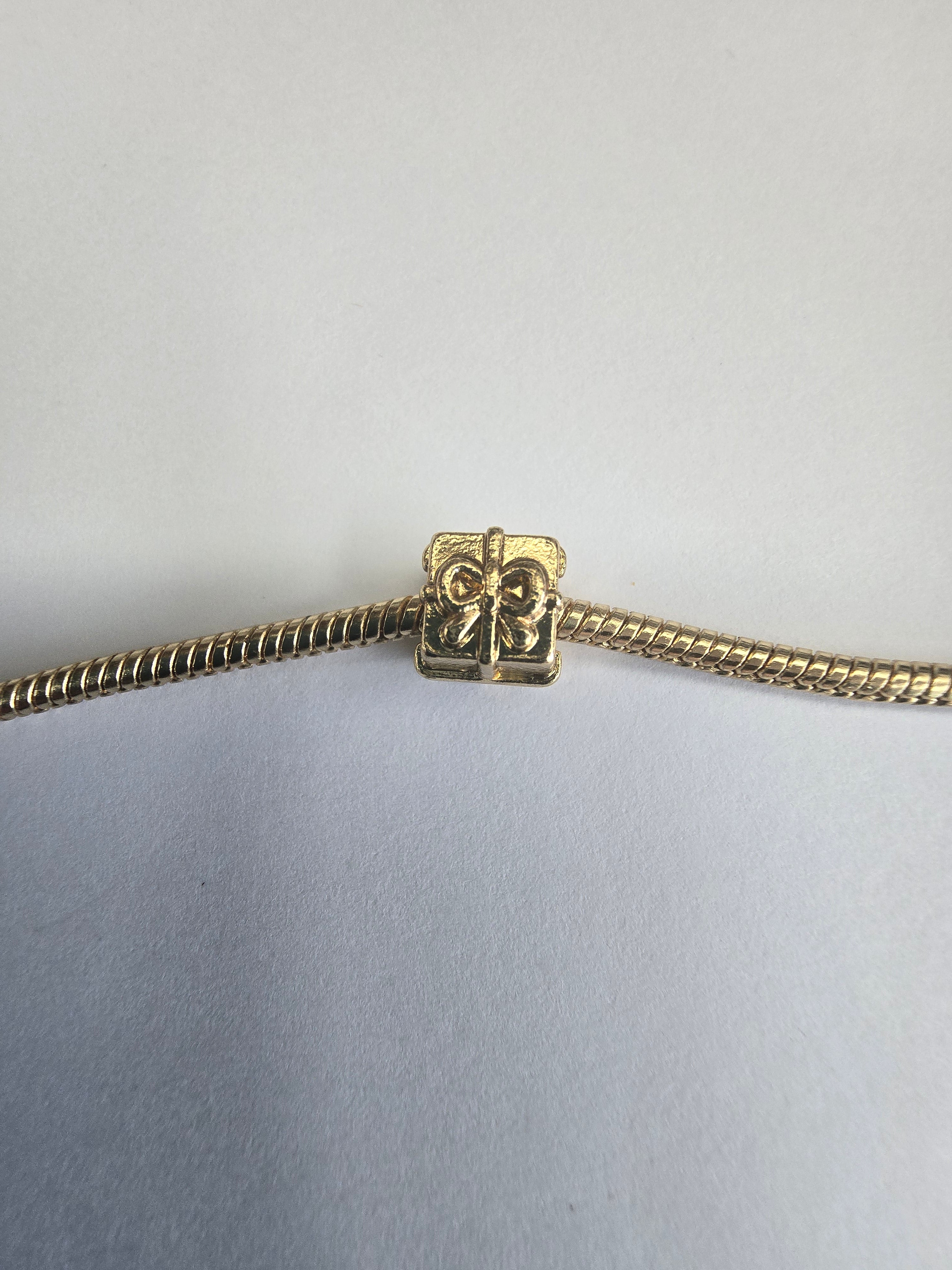 Gold charm fits all charm bracelets