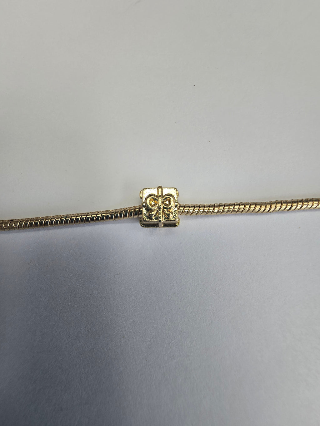Gold charm fits all charm bracelets