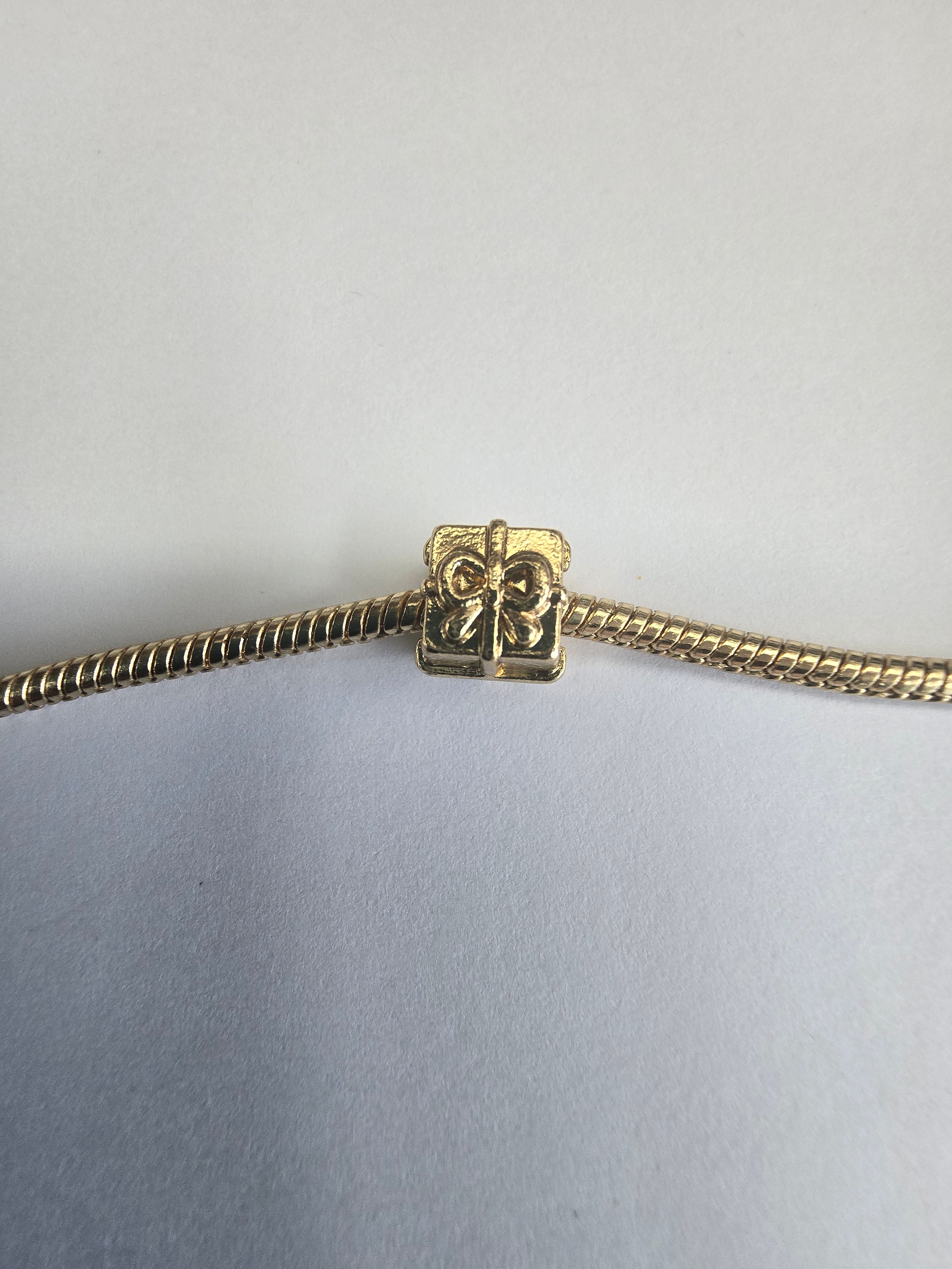Gold charm fits all charm bracelets