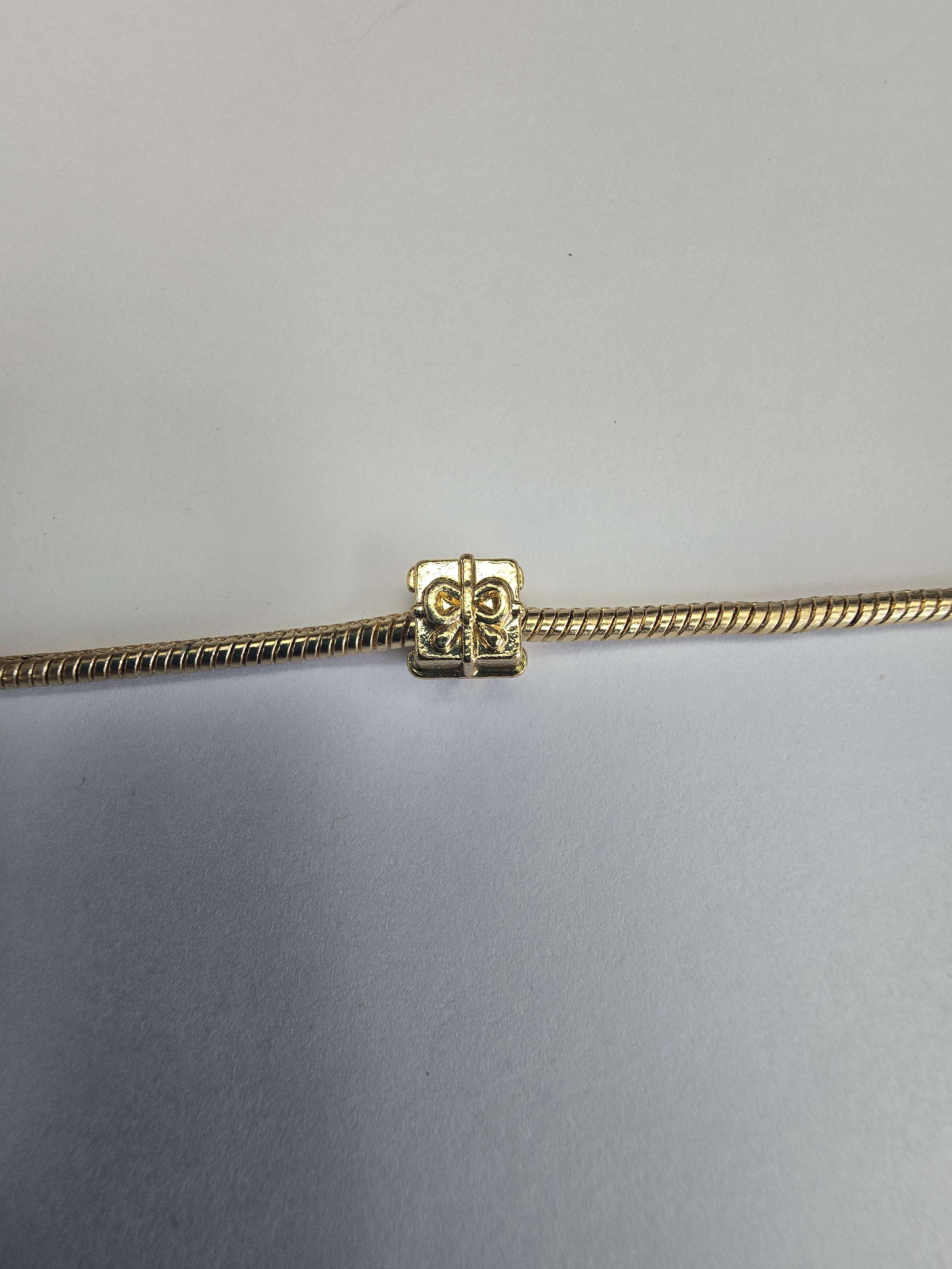 Gold charm fits all charm bracelets