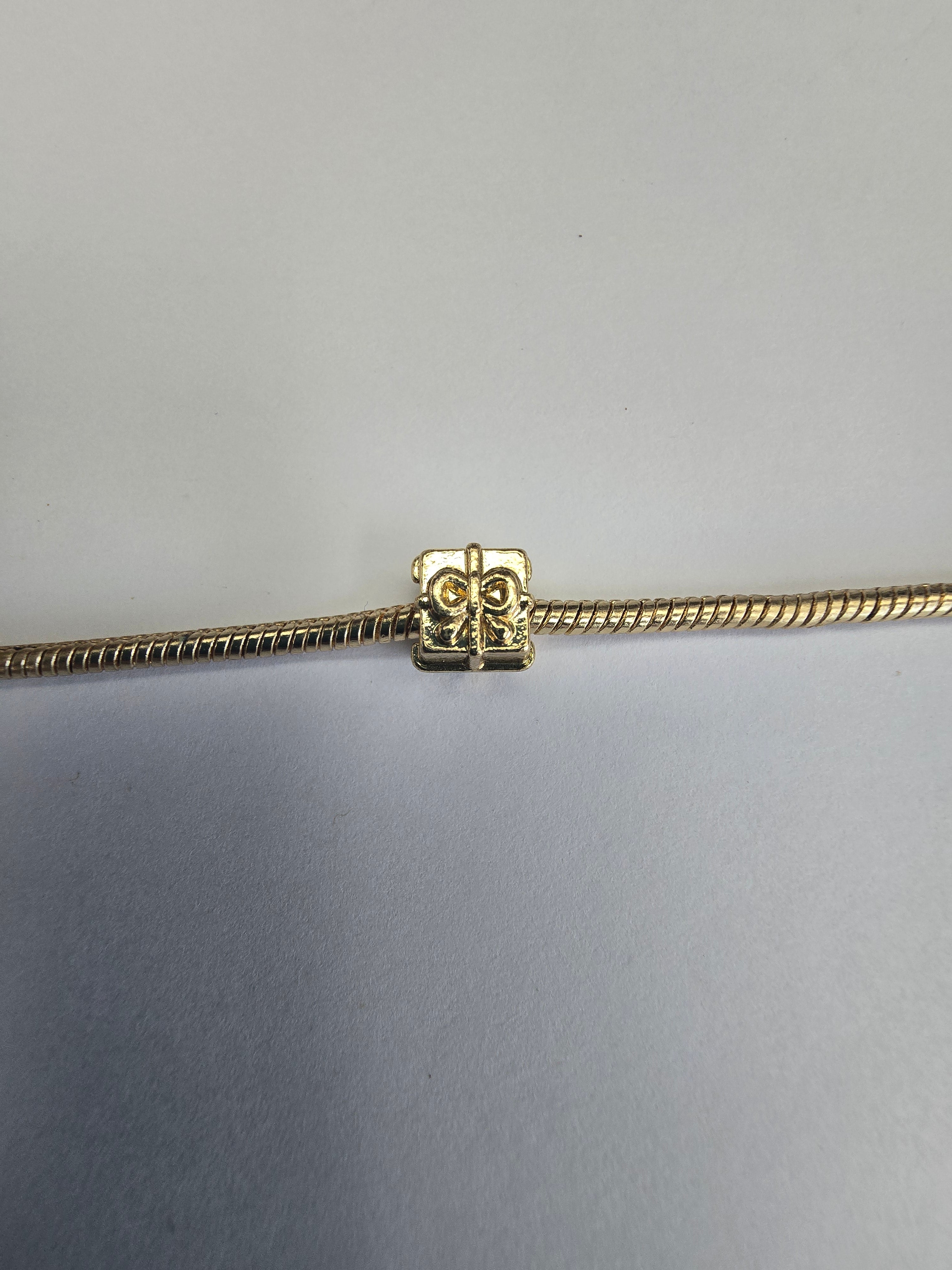 Gold charm fits all charm bracelets